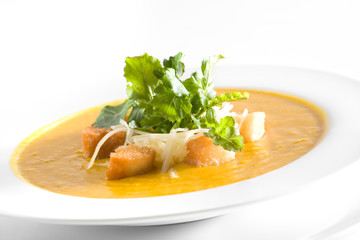 Pumpkin soup with croutons and parmesan cheese