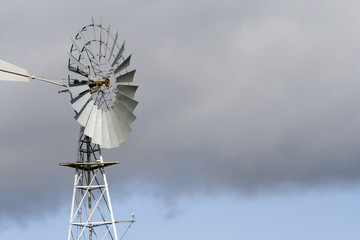 Windmill with a cloudy sky brackground