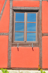 A close-up photo of an old french house window
