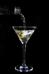 Martini being poured into a glass