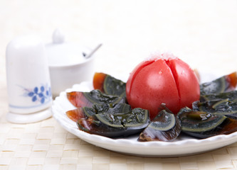 Chinese cold dish - century eggs and tomato.