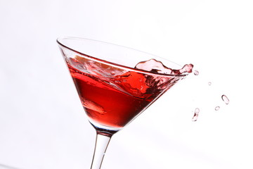 red cocktail on white