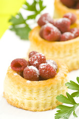 raspberry pastry cream and decorated with lemon parsley