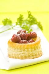 raspberry pastry cream and decorated with lemon parsley