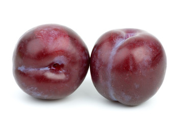 Two violet plums