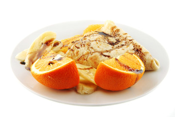 Fototapeta na wymiar pancake with orange on dish