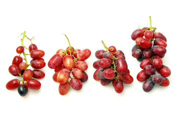 Bunch of pink grapes isolated on white background
