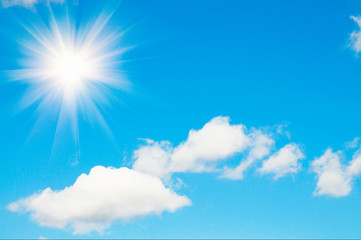 Obraz na płótnie Canvas Blue sky with fun sun and clouds.