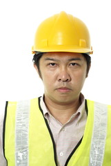 Asian construction contractor with blank expression