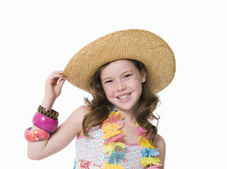 Close-up studio portrait of young girl in sunhat