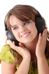 Fototapeta premium Beautiful teenage girl listening to music