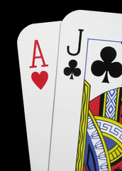 Close up of blackjack playing cards on a black background
