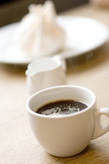 Fototapeta na wymiar cup of coffee, milk and meringue