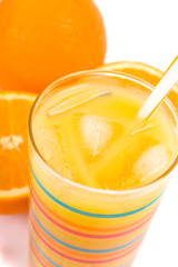glass of juice and oranges