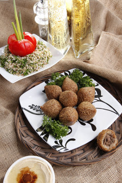 Middle eastern Fried Kibbe with Tabouli and Hummus Tahine