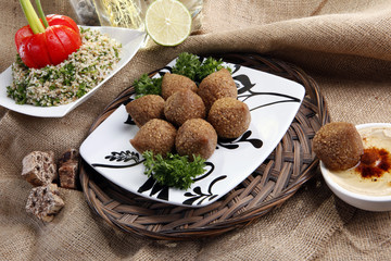 Middle eastern Fried Kibbe with Tabouli and Hummus Tahine