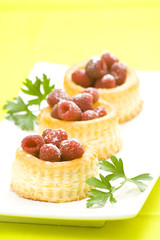 raspberry pastry cream and decorated with lemon parsley