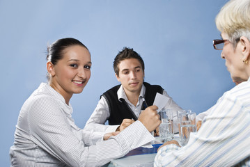 Young business woman in middle of meeting