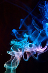 Blue smoke on black.