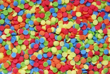 Fototapeta na wymiar Brightly-coloured Sugar confetti background