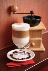 Composition with Latte and coffee-grinder