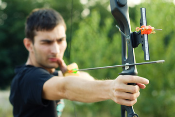 Attractive young archer sight his target