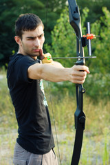 Attractive young archer sight his target