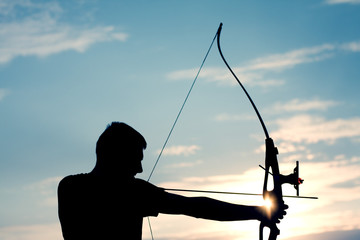 Attractive young archer sight his target