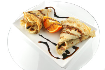 two pancakes on porcelan dish