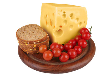 big chunk of yellow cheese with tomatoes and bread