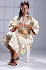 Fototapeta na wymiar Young Woman In Japanese Clothing