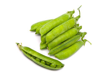 Pods of fresh green peas on a white background
