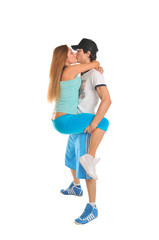 Young couple hugging on white