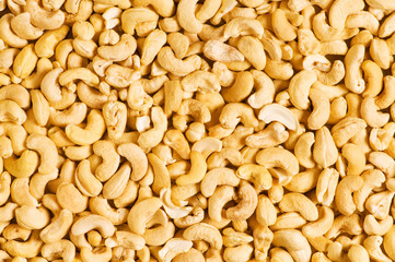 Cashew nuts arranged at the background