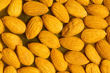 Fototapeta premium Fresh almonds arranged as a background
