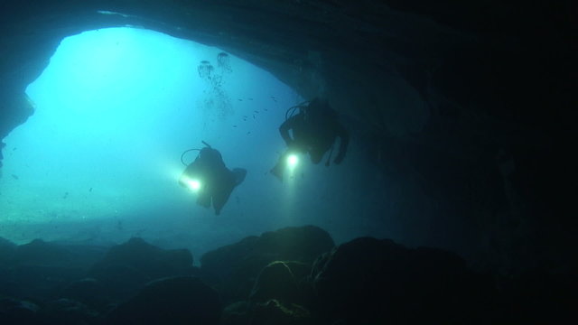 Divers in a cave
