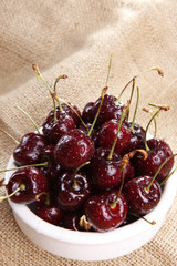 Sweet ripe cherries on sisal