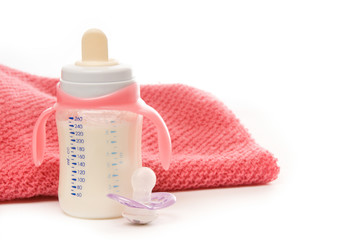 Baby bottle, pacifier and blanket