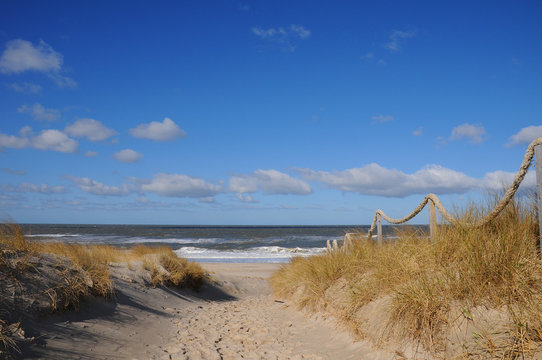 Fototapeta Strand sand wellen dünen einsam Urlaub