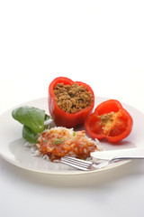 Red mince filled paprika with basil leaf, rice and sauce
