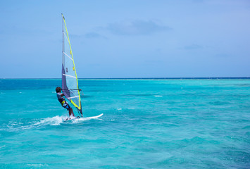 windsurfer on blue water