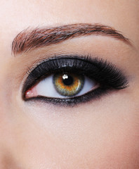 Fototapeta premium Eye with bright black glamour make-up