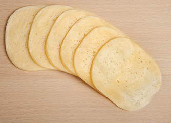 Cutting of cheese on a board on cutting of products