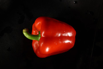 red peppers on a black background, vegetables