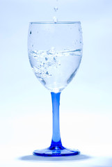 splashing water into glass