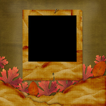 Old grunge card on the abstract background with autumn leaves.