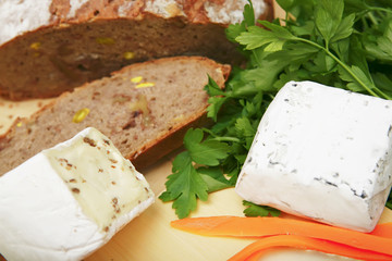 delicatessen cheese on cut board