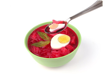 red vegetable soup over white