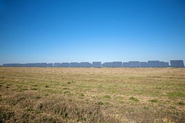 field full of solar panels