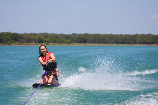 Young Woman Kneeboarding